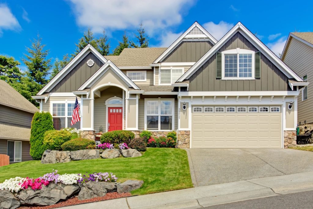 House in a neighborhood with a red entry door