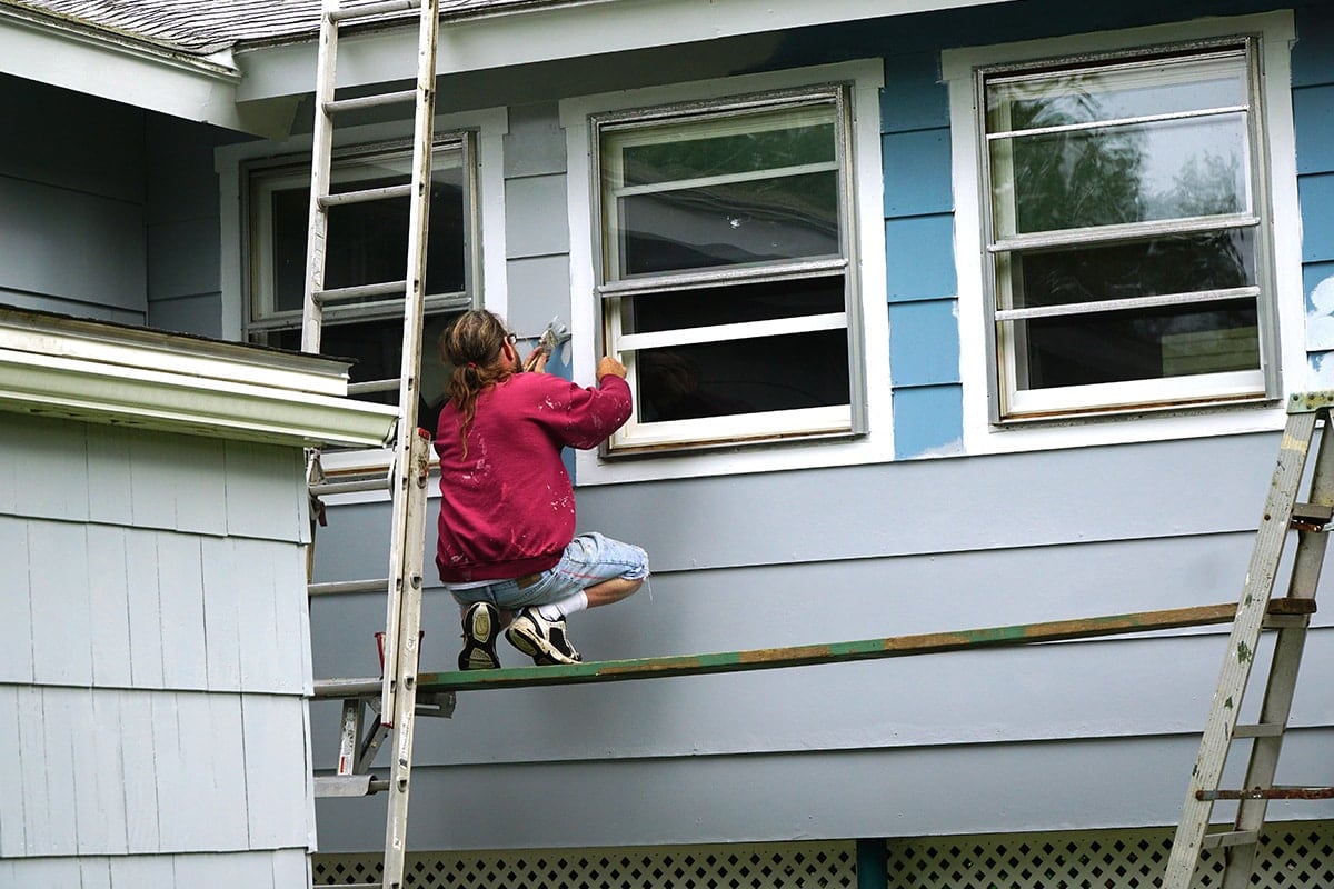 person working on historic home