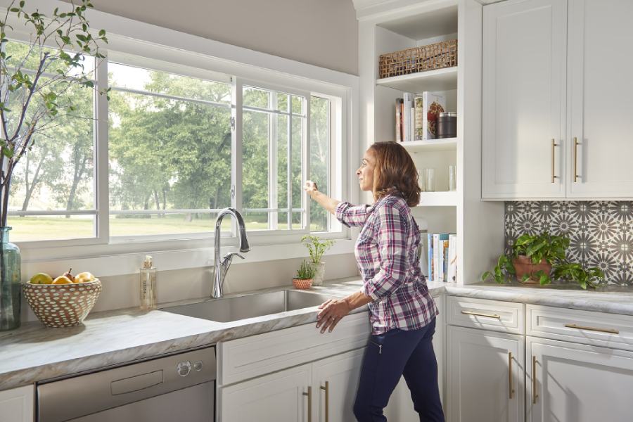 woman looking out window