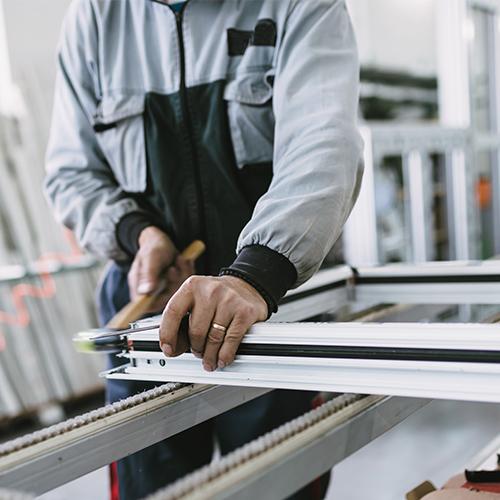 man building a replacement window